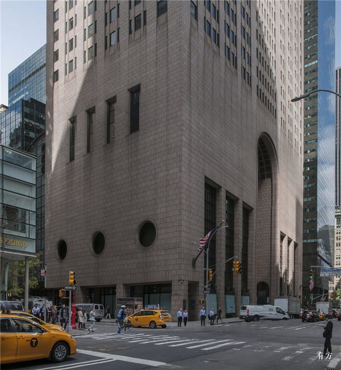 The building currently has a masonry frontage featuring a large arched opening